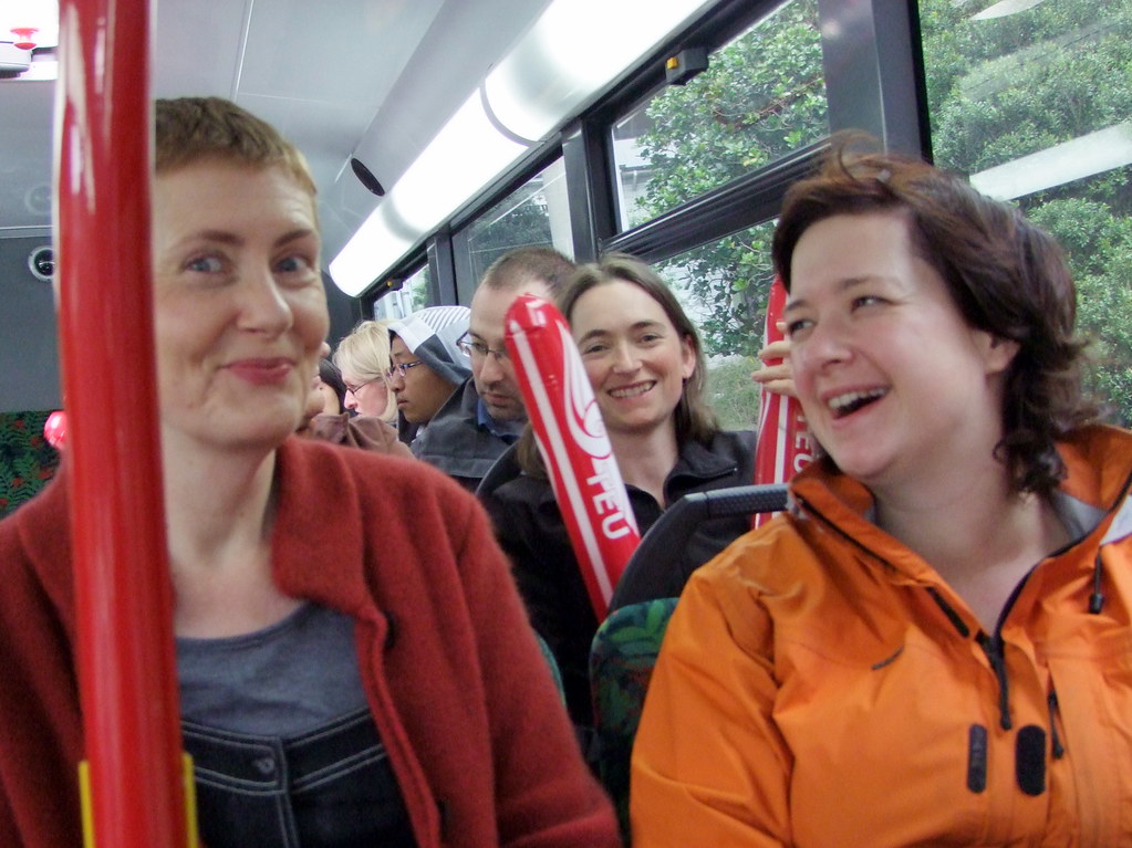 women chatting on a bus